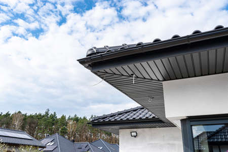 A modern graphite roof lining is attached to the trusses, visible cables and holes for LED lights.