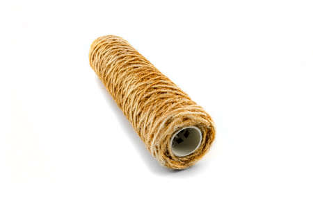 Dirty from rust water string filter, isolated on a white background.