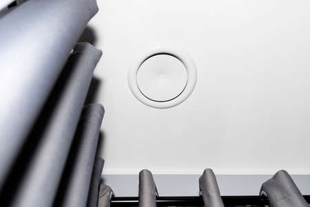 Domestic mechanical ventilation with heat recovery, a visible blowing anemostat on the ceiling in...