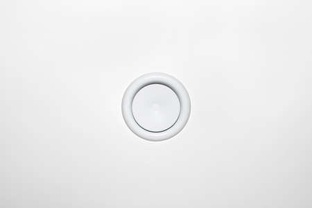 Domestic mechanical ventilation with heat recovery, a visible blowing anemostat on the ceiling in...