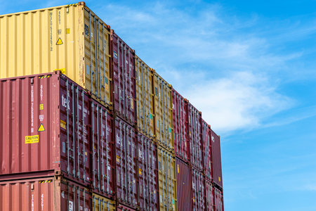 Andernach, Germany - May 15, 2022. A stack of containers standing on top of each other in the loading yard by the wharf.のeditorial素材