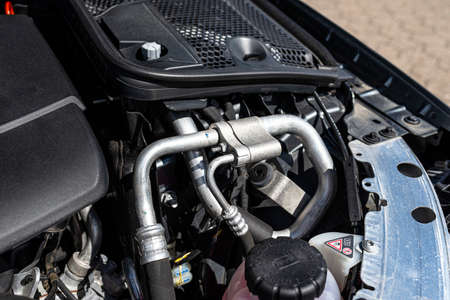 Aluminum air conditioning tubes with a cap, located in the diesel engine compartment.の写真素材