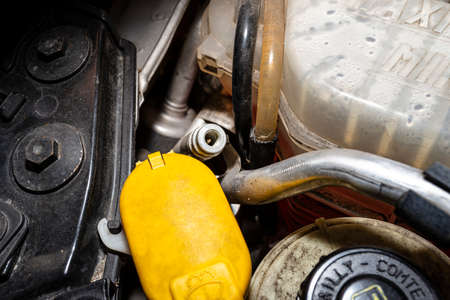 Open valves in passenger car air conditioning system for charging with R134a refrigerant.