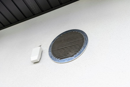 Air intake and exhaust in the wall of a single family house for mechanical ventilation with heat...