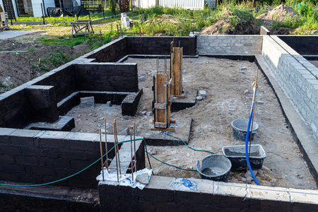 Footings made of concrete blocks painted with black dispersion asphalt-rubber mass, reinforced...