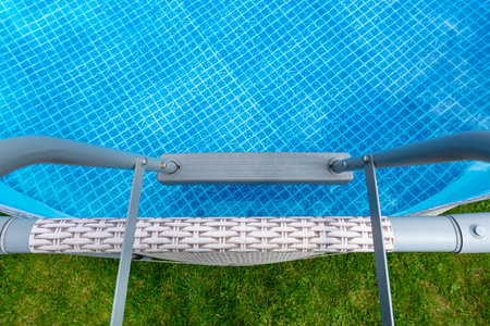 Large expansion pool with a diameter of 3.96 meters, placed in the yard on the grass.の写真素材