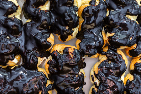 Baked choux pastry without cream and without icing, ready to make eclairs.の写真素材