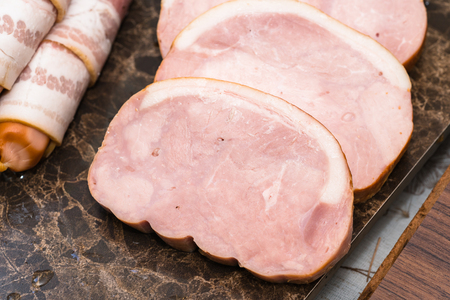 ham on wood backgroundの写真素材