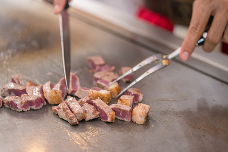 cooking beef steak on panの写真素材
