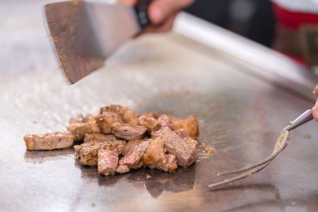 cooking beef steak on panの写真素材