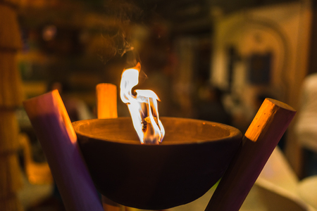 close up shot of flaming torch and fire.