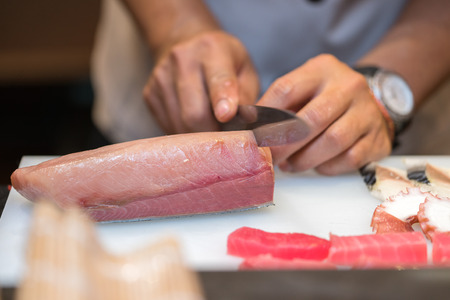 chef  preparing sushi in the restaurant kitchenの写真素材