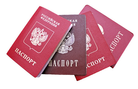 Several passports of a citizen of  Russian Federation isolated on white background. The inscriptions in Russian "Russian Federation. Passport"の写真素材