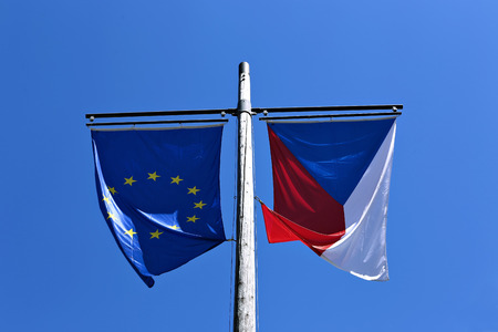 Flags of the European Union and the Czech Republic against the blue skyの写真素材