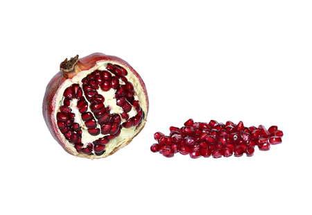 Fruit and red pomegranate grains isolated on white backgroundの写真素材