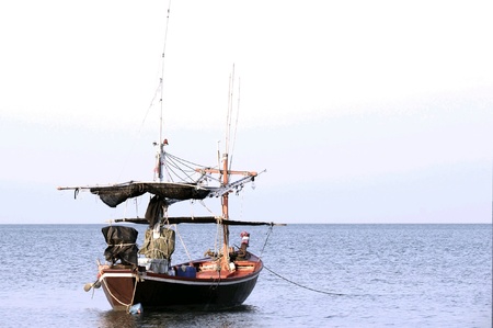 Small fishing boat at seaの素材