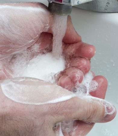 close up of hands being washed
