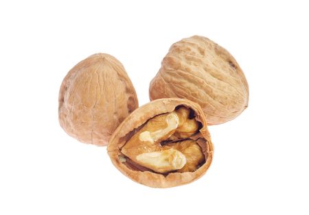 Three walnuts isolated on white backgound, on of them was cracked open