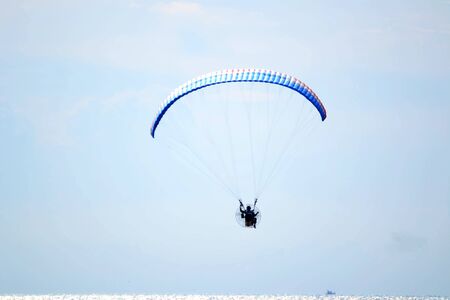 Paramotor are playing on the beach