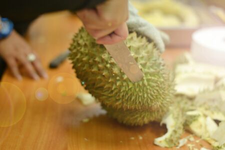 How to peel durianの写真素材