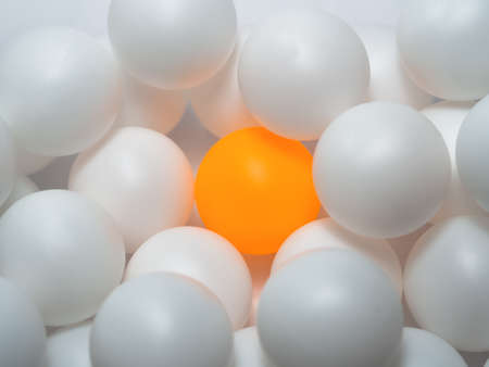 Orange and white table tennis balls Mixed colors, full backgroundの写真素材
