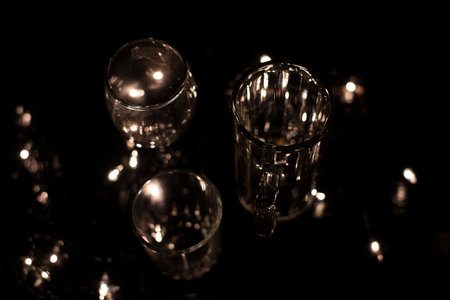 drink glass On a bokeh background, orange and dark, blurry