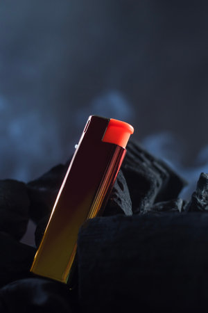 Lighter, shiny color, the back is black charcoal. There is a little white smoke