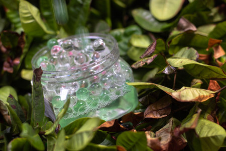 Air Freshener Crystal Beads, green, alternately clear and shiny, falling to each other. in motion on...