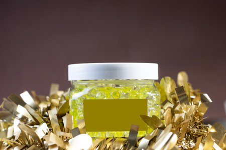 Air Freshener Crystal Beads in golden yellow on a gold background from the decorative libbin. The...