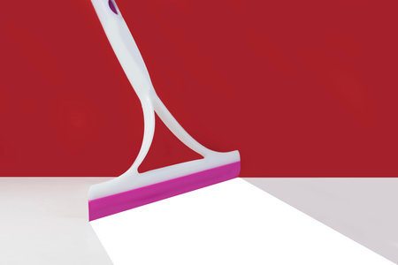floor squeegee on red background bottom white There are traces of cleaning, bright white