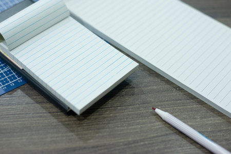 Pens and lined notebooks Place it ready for memorizing different notes or drawing and writing in other waysの写真素材