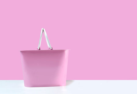 empty pink basket placed on a white background pink backdropの写真素材