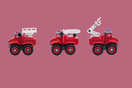 toy fire truck on a pink background,with clipping pathの写真素材