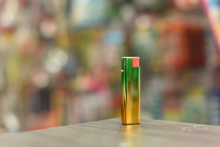 Rainbow lighter on a brown table The back has beautiful bokehの写真素材
