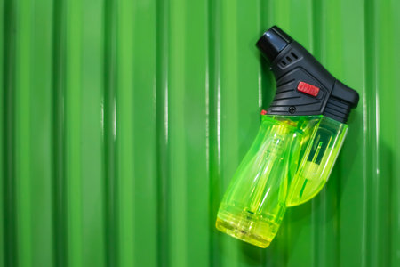 The Green lighter on green background with levelsの写真素材