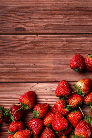 Strawberries on wooden background. Top view. Copy space.の写真素材