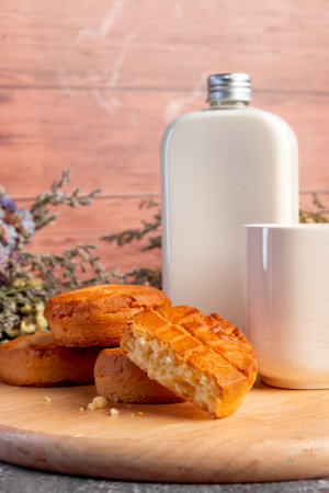 Milk and cookies on a wooden background. Close-up.の写真素材