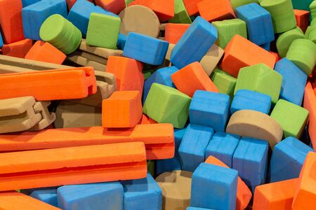 A group of coloured foam blocks in various shapes from cubes, rectangles, cylinders and more...