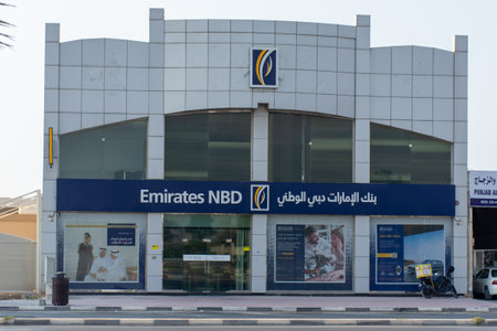 "Ras al Khaimah, Ras al Khaimah/United Arab Emirates - 10/11/2019: "Emirates NBD Bank PJSC  Bank (National Bank of Dubai) blue storefront on a blue sky sunny day. "のeditorial素材