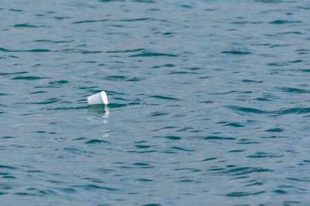 Plastic and styrofoam pollution in the ocean. Need for awareness of environmental protection, recycling, and protecting the world. Environmental concept copy space.の写真素材