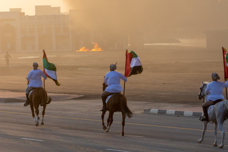 United Arab Emirates horses and flags in a parade.のeditorial素材