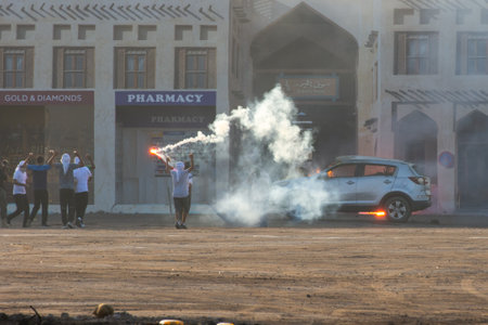 Military police riot response to a protest with tear gas, smoke, fire, explosions. Political expression, riot, protest, demostration and military concept.のeditorial素材