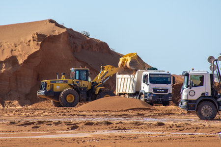 Ras al Khaimah, RAK/UAE - 1/12/2020: Construction excavation crew of bulldozers, dump trucks, and...