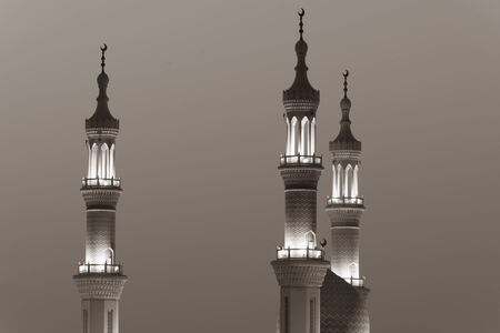 Islamic mosque spires in black and white echos prayer calls at night. Muslim, ramadan, religion concepts.の写真素材