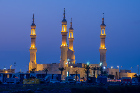 Sheikh's Zayed's Mosque glowing colors in Ras al Khaimah, UAE at night echos prayer call along the  Corniche.のeditorial素材