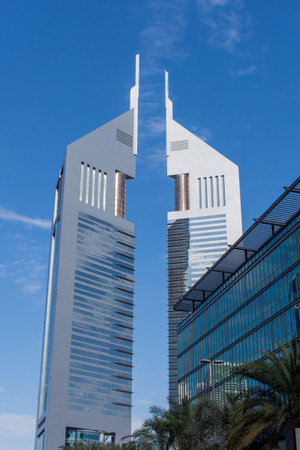 "Dubai, Dubai/United Arab Emirates - 1/25/2020: Dubai International Financial Centre (DIFC)  Emirates Tower modern Dubaiskyscraper on blue sky."のeditorial素材