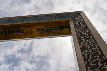 "Dubai, United Arab Emirates - 8/11/2020: The Dubai Frame modern architecture in downtown golden color on a blue sky sunny day."のeditorial素材