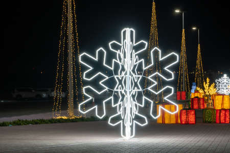 Christmas lights presents and snow flake outside for winter xmas festive themesの写真素材