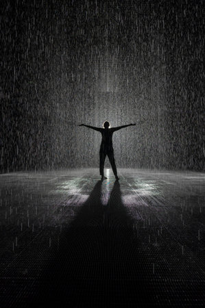 Rain room silhouette of women in black and whiteの写真素材