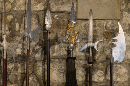 Ancient knightly spears on the background of a stone wallの写真素材